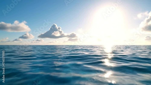 Serene Ocean Horizon with Sunlight Reflection and Soft Clouds