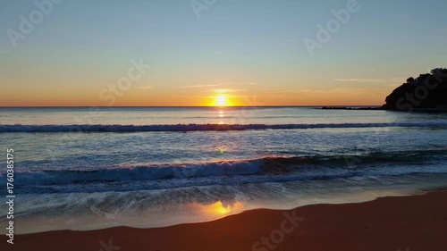 Peaceful Coastal Sunrise Under Clear Skies at Palm Beach on the Northern Beaches of Sydney, NSW, Australia.