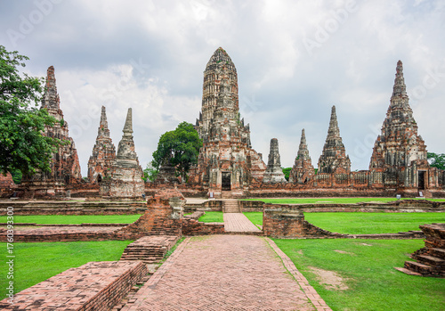 Majestic Ruins of Wat Chaiwatthanaram Temple in Ayutthaya, Thailand. Symmetrical view of the ancient central prang and satellite chedi ruins at Wat Chaiwatthanaram in Ayutthaya Historical Park.