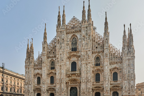 Wallpaper Mural The stunning Gothic facade of the Milan Cathedral (Duomo di Milano) dominates the square with its intricate spires and marble details. Architecture, landmark. Torontodigital.ca