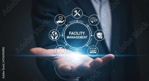 Person holding facility management digital interface hologram