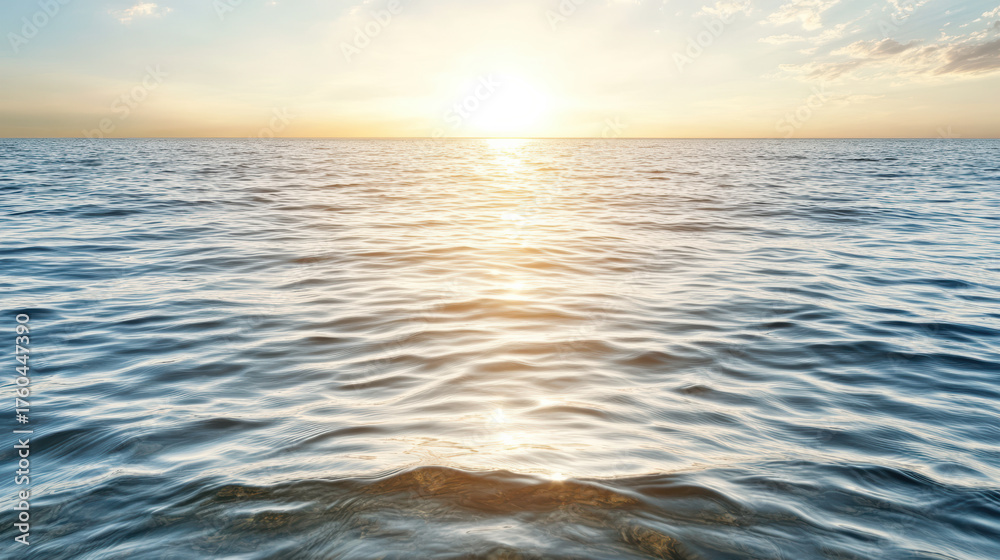 Fototapeta premium Golden light reflected on calm ocean surface creates peaceful atmosphere