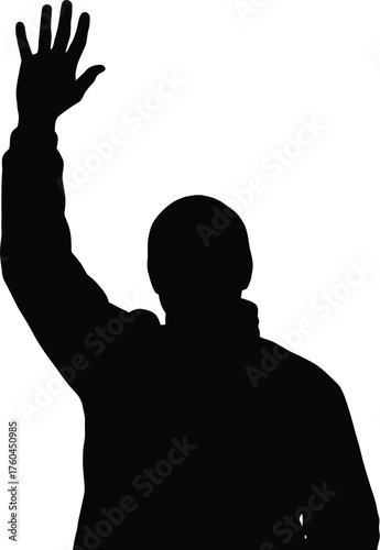 Silhouette of a man with his hand raised in a gesture of greeting
