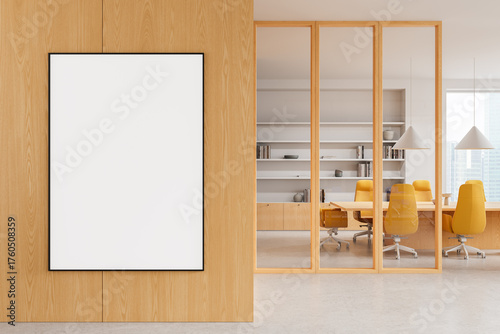 Modern office interior with blank poster on wooden wall and glass partition revealing meeting room with yellow chairs and shelves in background. 3D Rendering