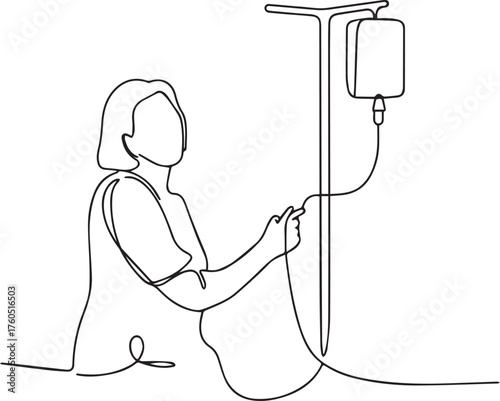 Medical professional in mask adjusting iv drip bag on stand