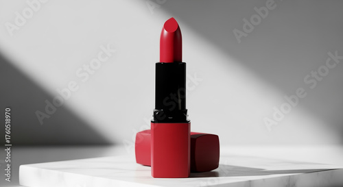 lipstick placed on a sleek, white marble surface with soft, diffused lighting. The background is minimalistic, with subtle shadows to highlight the product’s texture