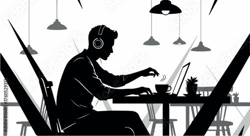 Focused man in headphones working on laptop in a stylish cafe with ambient lighting