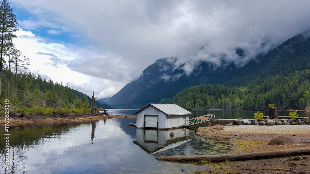 Fototapeta premium Dramatic Landscape of Buntzen Lake with Pine Forests and Rain Clouds
