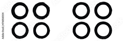 Four black circles arranged in two rows, focusing on simple geometric patterns and shapes