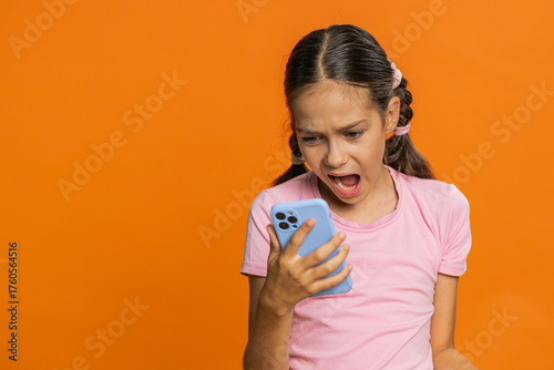 Cuadro en lienzo Upset sad preteen child girl kid use smartphone typing browsing, play game, loses, surprised by sudden lottery results, bad fortune, loss, fail, unlucky news