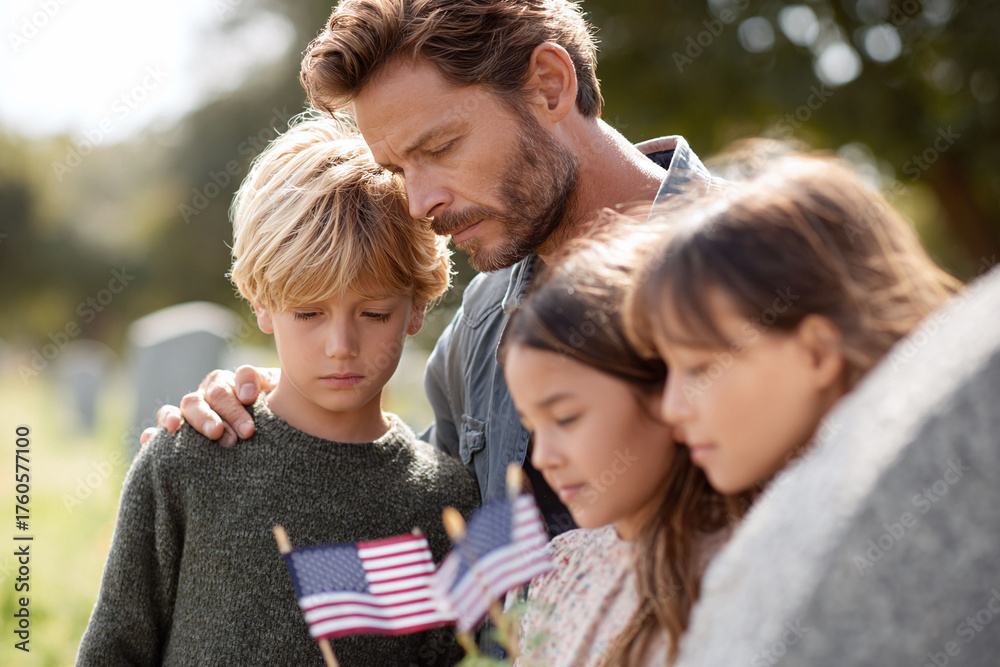 Fototapeta premium A poignant image shows a father with his three children at a gravesite, holding American flags, symbolizing remembrance, patriotism, family values, and grief.