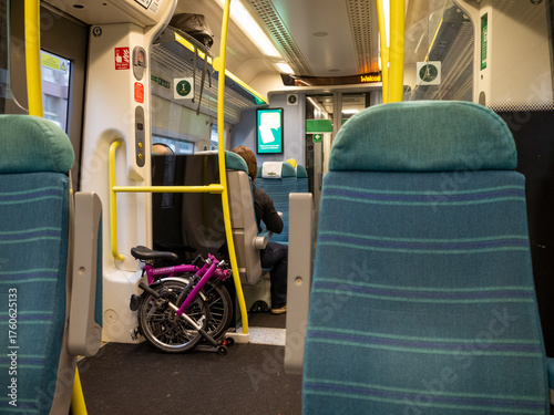 Inside train with bike and passengers