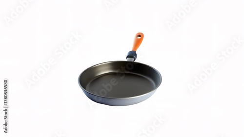 A sleek frying pan with an orange handle against a white background.