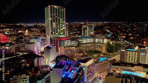 St Julian’s Paceville district glows under the night sky. 4K drone showcases architectural contrast, nightlife movement and radiant rooftop scenes