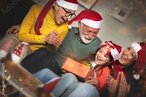 Family in opening gifts on Christmas