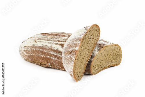 Freshly baked whole grain bread loaf and slices showing soft texture and rustic crust