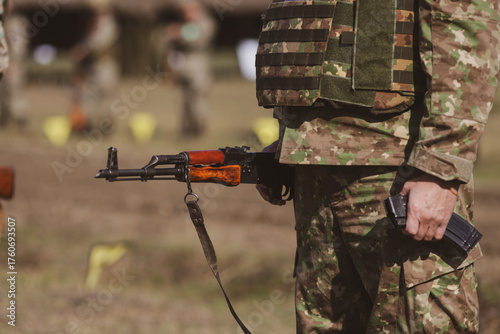 Fotografie Romanian reservist takes part at a drill where he trains to shoot weapons