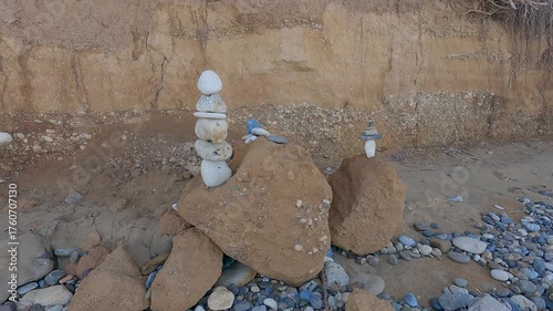 Ocean sea coast shore erosion of soil sand land falling down, roots of trees