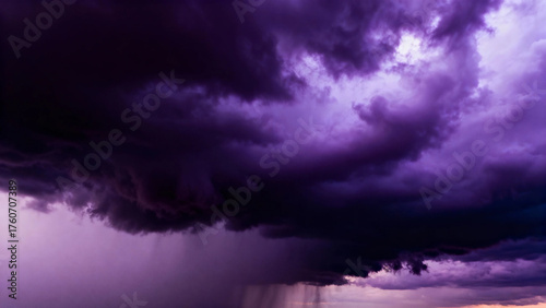 Dramatic purple storm clouds with heavy rainfall and dark sky