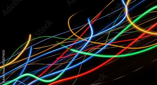 Abstract light painting with colorful trails on a black background, creating a dynamic and mesmerizing visual effect