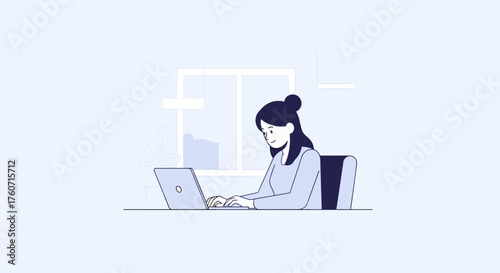 Professional woman working on laptop in modern office environment