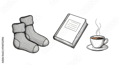 Minimalist monochrome still life arrangement of socks book and coffee cup