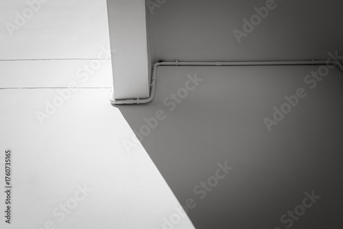 Canvas Print Minimalist architecture wall with shadow and light on corner and pipe line