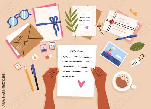 Person holding love letter writing correspondence on desk