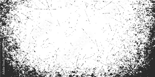 A dark abstract grunge background with ink splash and dirty texture creates an old black and white pattern for illustration and design