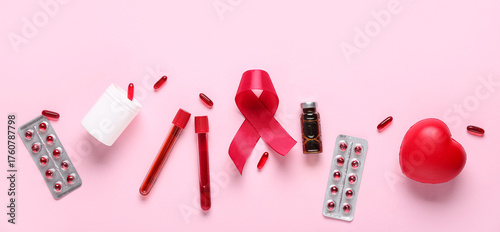 Red ribbon with pills, test...