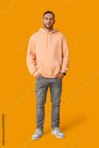 Stylish young man in jeans ...