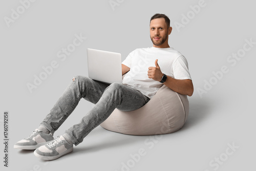 Stylish young man in jeans ...