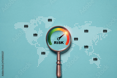 Magnifying glass focusing on risk level gauge with world map background representing global business risk management strategy assessment and financial analysis concept