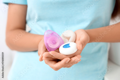 Young woman holding differe...