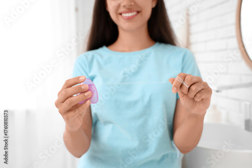 Young woman with dental flo...