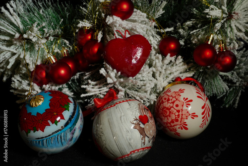 Collection of Christmas decorations arranged on a dark background. Festive ornaments and seasonal elements symbolizing the joyful spirit of the holiday season