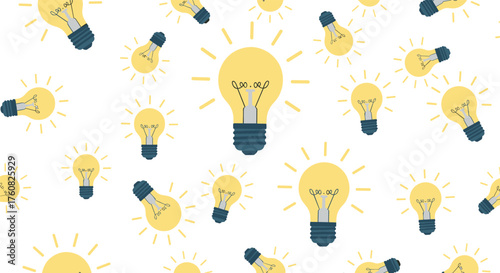 A pattern of bright idea light bulbs glowing and shining.