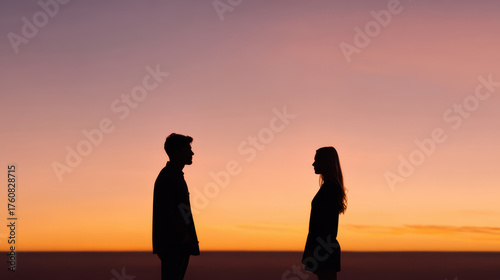 Silhouettes of two people against a beautiful sunset, conveying connection and romance in a serene atmosphere.