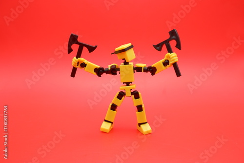 Yellow Action Figure Holding Dual Axes on Red Background