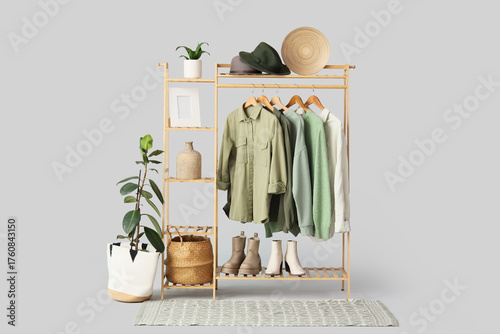 Wooden rack with stylish cl...