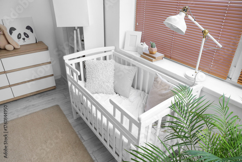 Comfortable crib and lamps ...