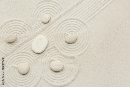 Photography Spa stones on light sand as background, closeup. Zen concept
