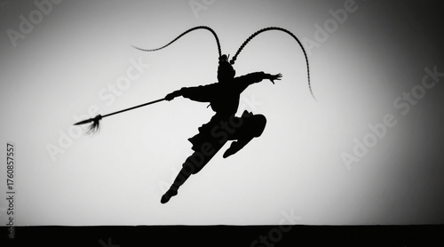 Silhouettes of Chinese opera characters, silhouettes of opera warrior characters, leaping into the air, with spears dragging out arcs