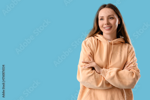 Dreamy young woman on blue ...