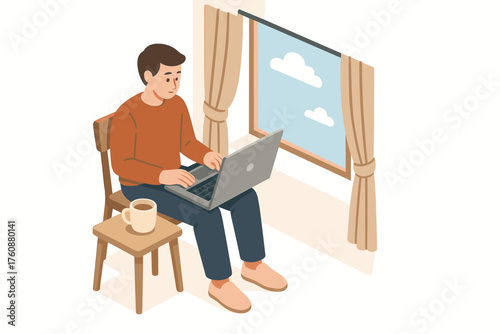 Young caucasian male working on laptop near window with coffee cup