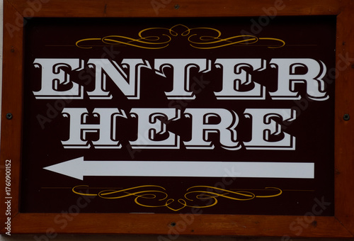 Enter here sign at store area.