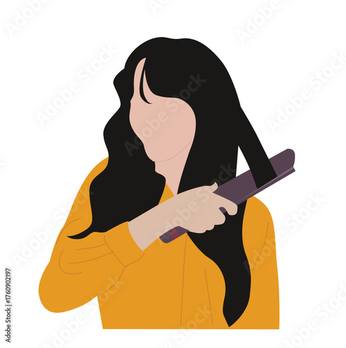 woman straightening hair.Young girl with hair straightener makes her hair straight 