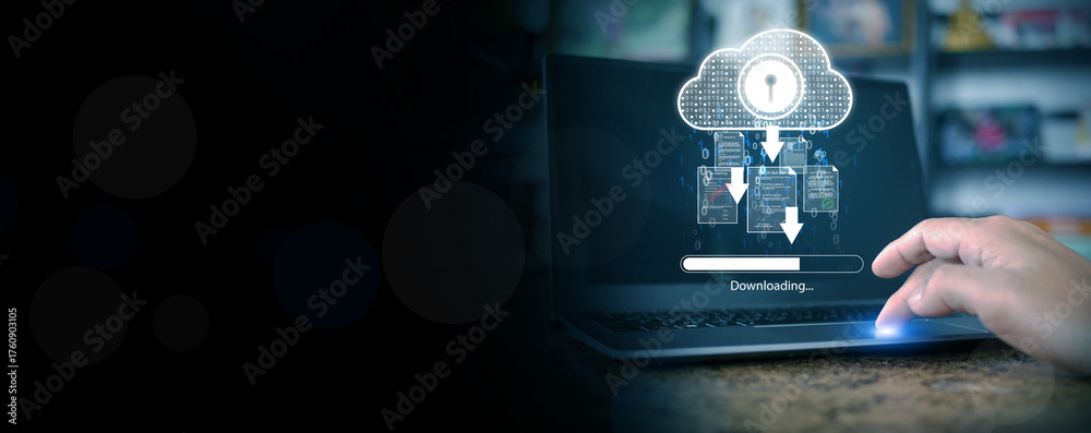 Fototapeta premium Hand touching laptop with holographic cloud download icon and security lock symbol, representing secure data transfer, cloud computing, and digital information storage technology.