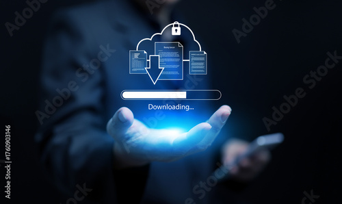 Canvas Print A businessman holding a holographic download icon