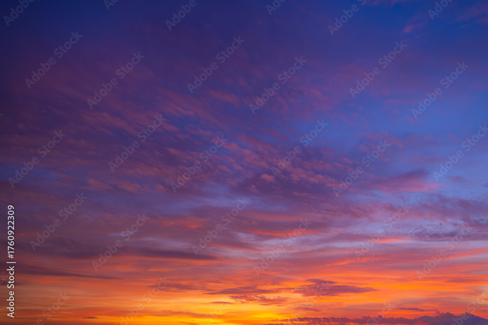 Obraz premium Twilight sky at sunrise and sunset,Sky at sunrise. Sunset background. Sunrise through clouds on sky. Twilight sky with sunrise colors. Peaceful dawn with soft light. Dramatic dusk sunrise with clouds.